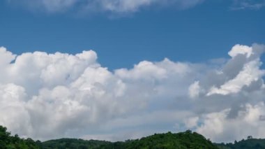 Summer Clouds background.Amazing sky white clouds over mountains.Cloudscape timelapse Amazing summer green sky Time Lapse. Nature sky good weather day nature environment background 4-K