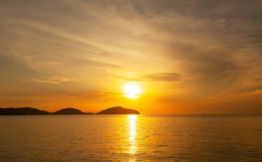 Landscape Long exposure of majestic clouds in the sky sunset or sunrise over sea with reflection in the tropical sea.Beautiful cloudscape scenery.Amazing light of nature Landscape nature background