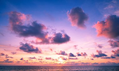 Landscape Long exposure of majestic clouds in the sky sunset or sunrise over sea with reflection in the tropical sea.Beautiful cloudscape scenery.Amazing light of nature Landscape nature background