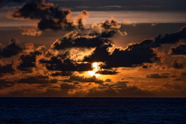 Sunset at the open sea, Horizontal photo with natural sunset or sunrise light and darkness sea waves background