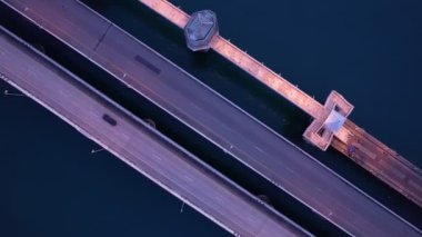 Aerial view drone shot of Amazing bridge with cars on bridge road. Transportation and travel background. Located at Sarasin bridge in Phuket Thailand