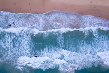 Aerial view sandy beach and big waves crashing on sandy shore, Beautiful tropical sea in the morning summer season image by Aerial view drone shot, high angle view Top down