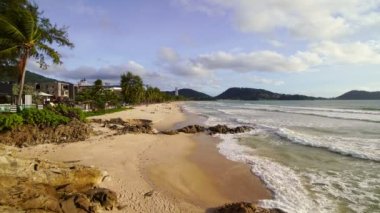 Phuket thailand people relax on the patong beach Phuket thailand in summer travel season Tourist are enjoying activities on the beach during the holidays Phuket patong beach at Sunset time