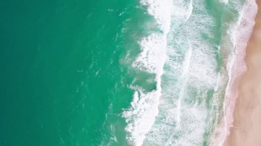 Top view tropical beach Amazing waves sea background. Crashing waves on beach sand, Beautiful sea background