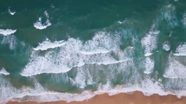 Top view tropical beach Amazing waves sea background. Crashing waves on beach sand, Beautiful sea background