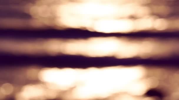 Blurred Orange Sea Sunset Sun Reflects Sparkles Waves Bokeh Lights — Stok video