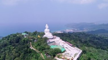 White Marble Big Buddha Statue Temple. Close Up Aerial View big buddha on top of mountains at Phuket Thailand