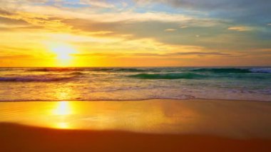 Sea at sunset or sunrise over beach video 4K, The sun touches horizon, Red sky in golden hour amazing seascape,Ocean beach sunsets,The sun in spindrift clouds Fantastic natural sunsets