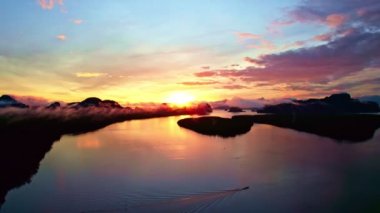 Aerial view sky, Beautiful view colorful sunset or sunrise over sea surface beautiful wave Amazing light twilight sky sunset. Cinematic drone shot dynamic footage beautiful light of nature seascape