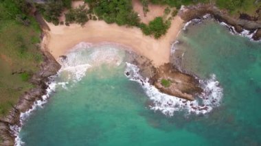 Aerial view Top down seashore big wave crashing on rock cliff, Beautiful dark sea surface in sunny day summer background, Amazing seascape top view seacoast,High quality footage