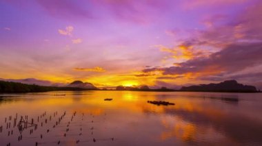 Time Lapse nature Beautiful Light sunrise or sunset sky colorful clouds scenery. Sky with reflection on sea water surface. Amazing clouds in sunrise sky background