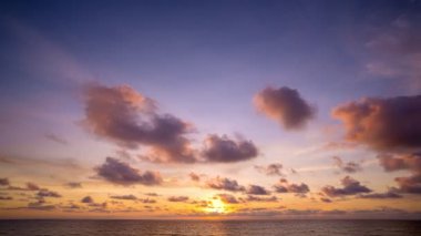 Time Lapse nature Beautiful Light sunrise or sunset sky colorful clouds scenery. Sky with reflection on sea water surface. Amazing clouds in sunrise sky background