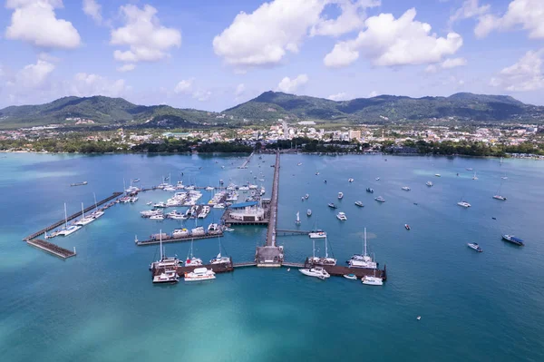 Chalong pier with sailboats and other boats at the sea,Beautiful image for travel and tour website design,Amazing phuket island view from drone seascape landscape,Summer day