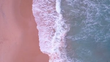 Top view tropical beach Amazing waves sea background. Crashing waves on beach sand, Beautiful sea background