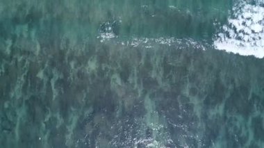 Top view tropical beach Amazing waves sea background. Crashing waves on beach sand, Beautiful sea background