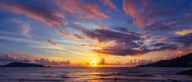 Landscape Long exposure of majestic clouds in the sky sunset or sunrise over sea with reflection in the tropical sea.Beautiful cloudscape scenery.Amazing light of nature Landscape nature background