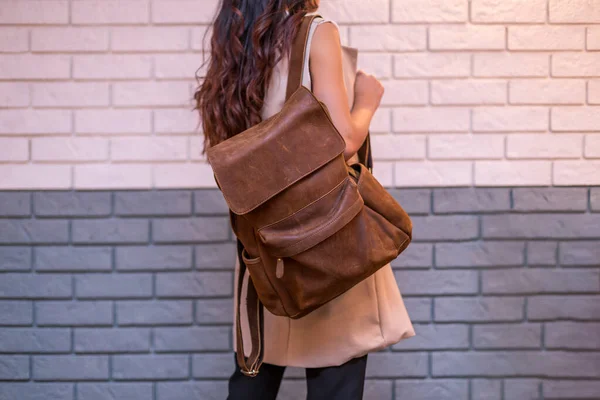 Woman Holding Brown Leather Backpack Hand Brick Wall Background Unisex — Stock Photo, Image