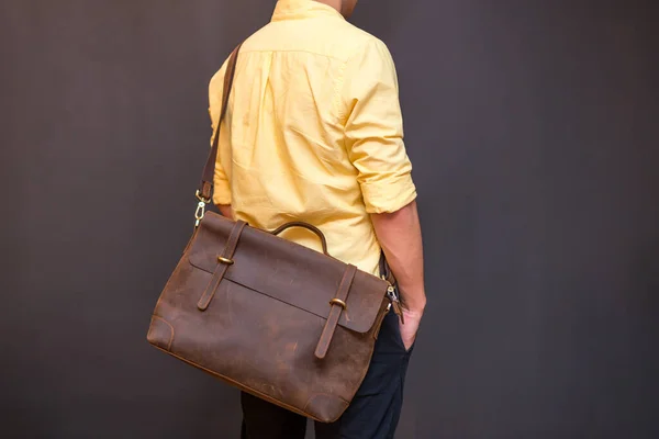 Man Carries Brown Leather Messenger Bag Hand Gray Background Unisex — Stock Photo, Image