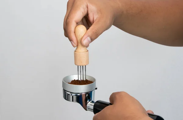 hand mash coffee bean in coffee grinder