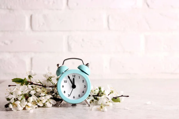 Blue Alarm Clock Apple Blossom Branches White Brick Wall Festive — Stock Photo, Image