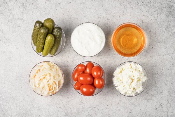 Variety Fermented Foods Gut Health Bowls Gray Background Cucumbers Tomatoes — Stock Photo, Image