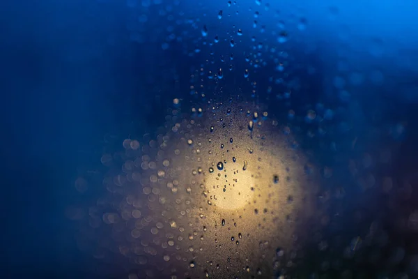 Drops on glass in the evening light — Stock Photo, Image