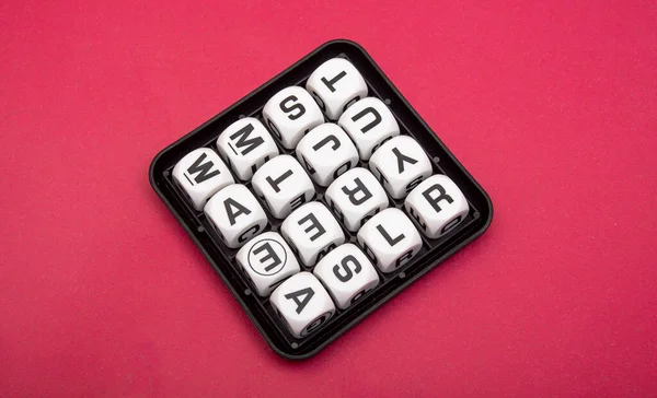 Boggle game text blocks in random order.