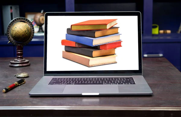 E-book library online education concept with laptop and stack of books on table.