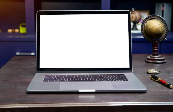 Laptop screen mockup on office table with blank screen.