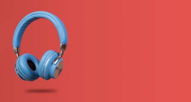 Kırmızı afişte izole edilmiş kablosuz kulaklığın yan görünümü.