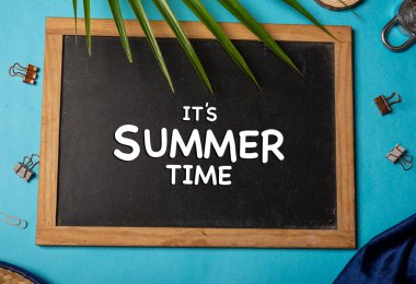 It's summer time banner with tropical leaves on blue banner.