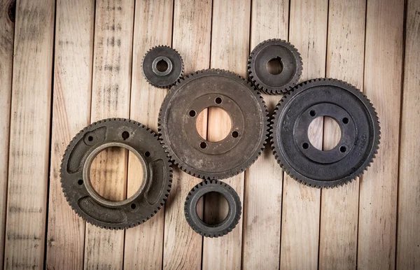 Multiple Size Gears Joining Each Other Wooden Table Top View — Stockfoto