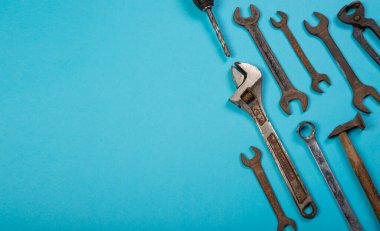 Different hardware tools on blue banner template with copy space.