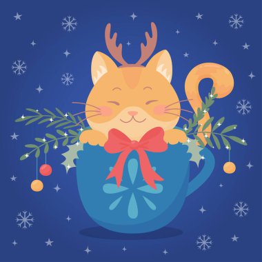 Cute red cat in a cup with spruce branches and christmas balls.
