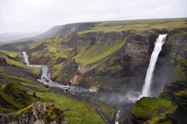 Haifoss is a waterfall situated near the volcano Hekla in southern Iceland. The waterfall Granni is next to it. The river Fossa drops here from a height of 122 m. clipart