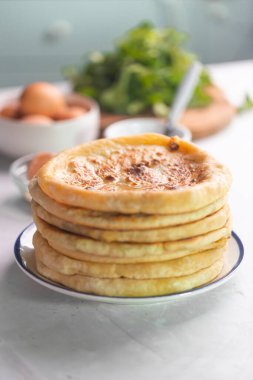 Khachapuri cheese bread, traditional caucasian or Georgian national food on a white background with ingredients
