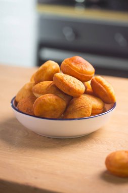 Traditional Kazakh Asian baursak dish prepared with dough on a pan with oil