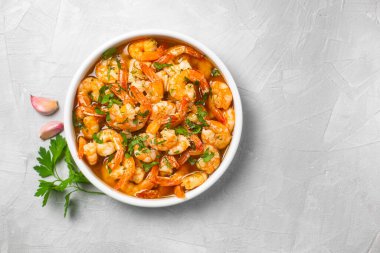 Traditional spanish shrimp with garlic, usually prepared with olive oil. Culture of Spain clipart