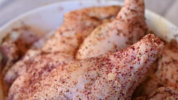 Duck thighs is prepared to be fried in a frying pan with spices — Stock Video