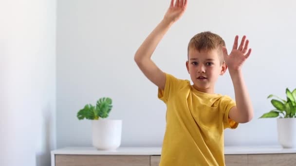 Boy doing pantomime at home. Video with copy space — Stock Video