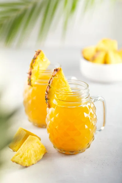 Pineapple juice in a jar on the gray background — 스톡 사진