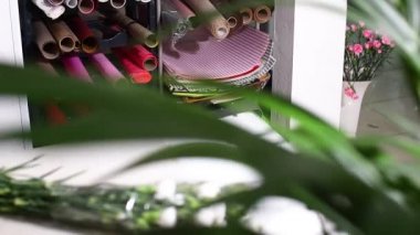 Paper and items for decorating bouquets in a flower shop