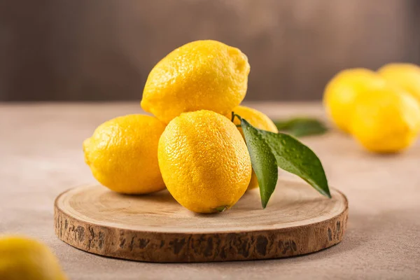 Ripe Yellow Lemons Close-up Background Or Texture. Lemon Harvest, Many Yellow Lemons.