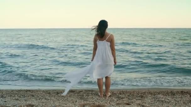 Young Girl White Dress Stands Seashore Looks Distance Stands Alone — Vídeo de Stock