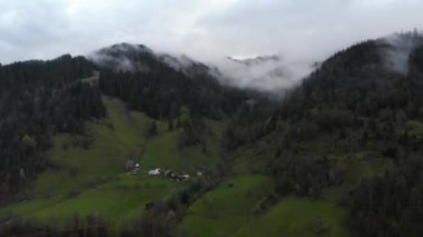 A view of the snowy tops of the mountains from a birds flight. 4k.