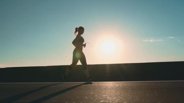 Girl Runs Road Sunset Side View Sportswoman Healthy Lifestyle Running — Stockvideo