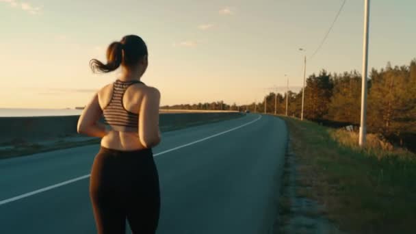 Young Girl Engaged Sports Jogging Road Background Sky Grass Healthy — Video