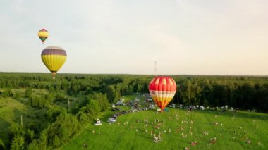 UKRAINE, Kolonshchyna - June 27, 2020: Balloon festival.Colorful hot air balloons rise above the hot air balloon festival. Aerophotography. View from above. High quality 4k footage