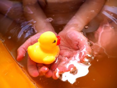 Yellow rubber duck for swimming. Bathing children in the tub. Hygiene of the child. clipart