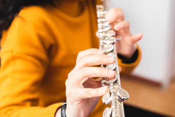 Unrecognizable Woman Yellow Sweater Playing Transverse Flute Reading Sheet Music — Fotografia de Stock